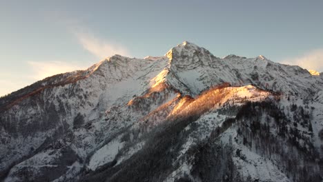 aerial-view-of-Austrian-Alps-summit-lit-by-golden-hour-sunlight