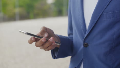 male hand using modern smartphone.