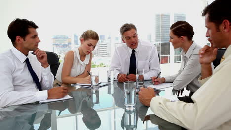 Boss-pointing-at-employees-at-the-meeting-room