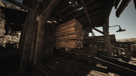 a close-up of a pile of lumber inside a dilapidated, wooden shed