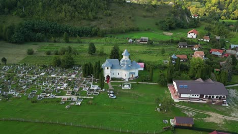 blue monastery near cemetery in palanca village, bacau county, western moldavia, romania