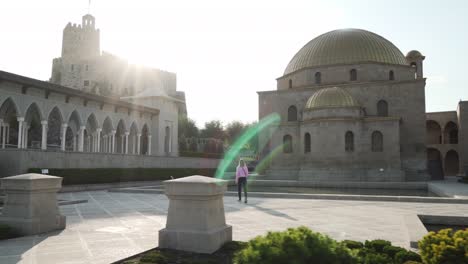 young caucasian female blond girl walking in middle eastern arabic castle