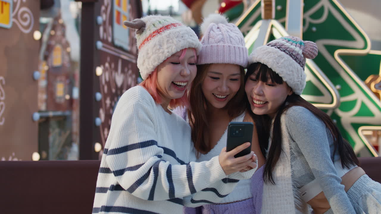 Group of Friends Taking Photos at Christmas