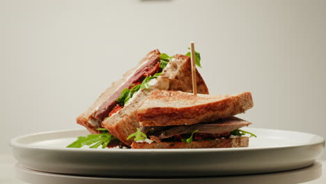 delicious toasted sandwich with beef and arugula