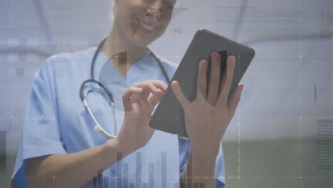 Healthcare clinician holding tablet, displaying digital health dashboard with charts and metrics