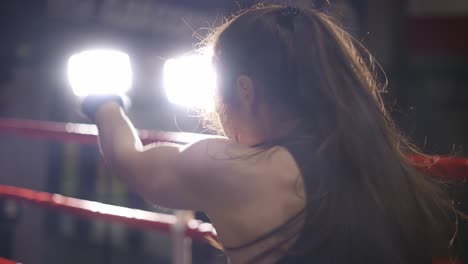 Female-Boxer-Performing-Punching-In-Bandages-In-Slow-Motion