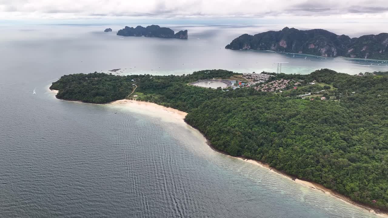 Loh Moo Dee beach in Koh Phi Phi Don Island. Tropical island vibe, travel Thailand. Cloudy sky