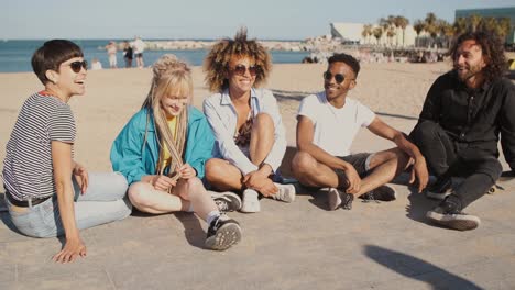 Happy-young-friends-on-city-seashore