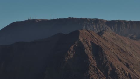 aerial parallax shot of vast mountain ranges in iquique, chile