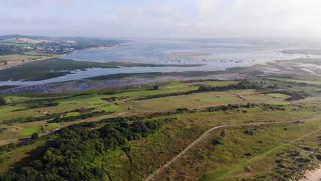 aerial pan right view of dawlish golf course and mouth of river exe