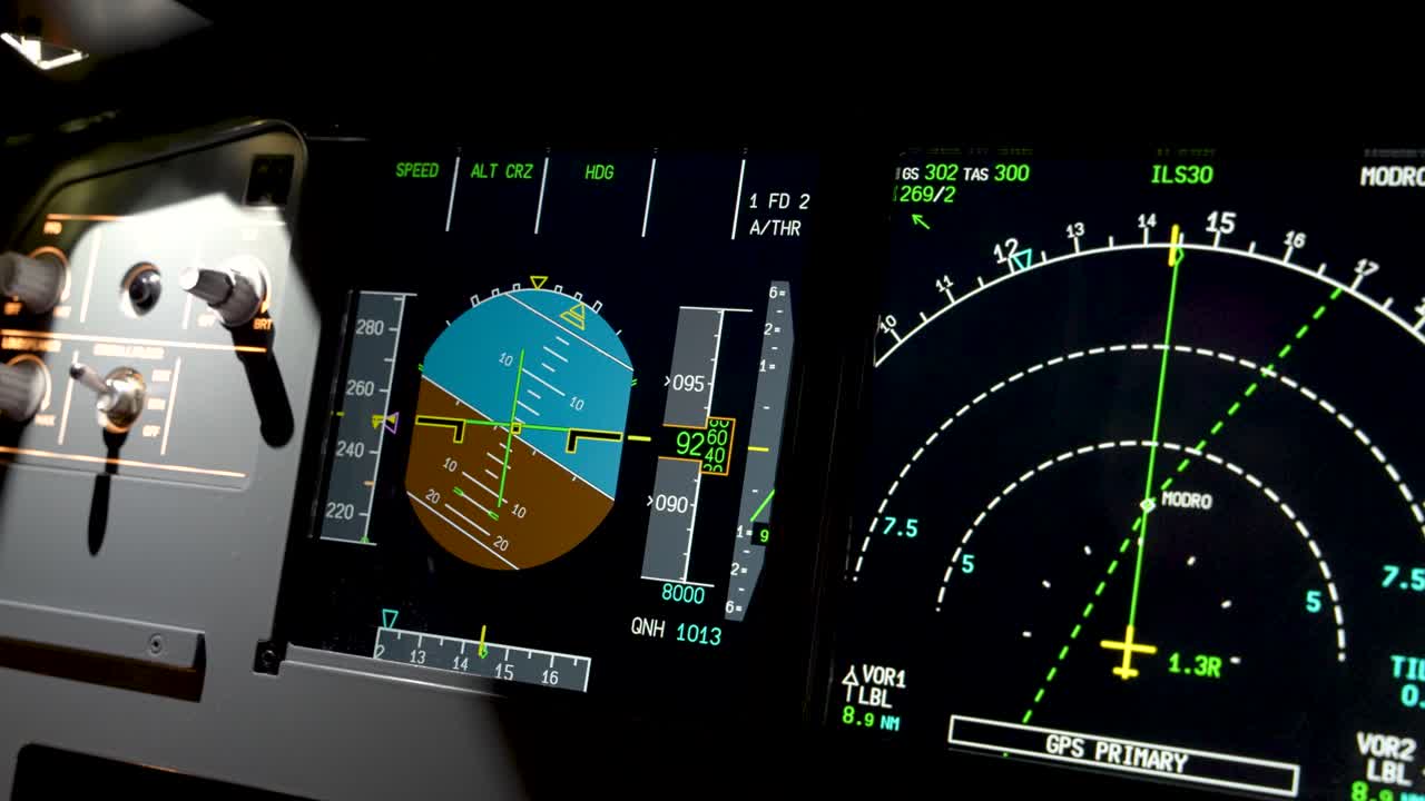 Static close-up shows Airbus A320 cockpit monitors—primary flight and navigation displays with attitude, speed, altitude tapes and radar—illustrating modern glass-cockpit avionics