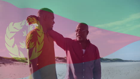 eritrean flag animation over two men talking on beach, enjoying conversation