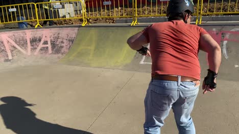 skater gracefully navigates down and across the ramps of a skate park in estoril, showcasing impressive skills and fluid movements in the dynamic world of skateboarding