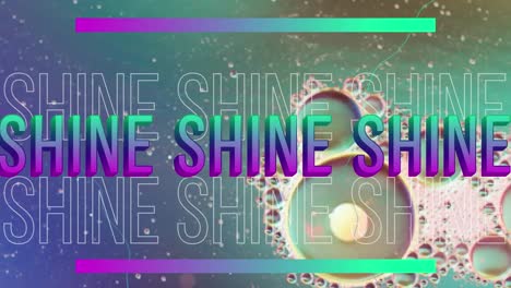 Animation-of-shine-text-over-close-up-of-liquid-and-baubles