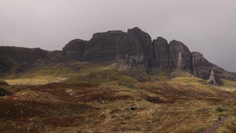 black cliff hill side on a hike through the isle of skye, highlands of scotland