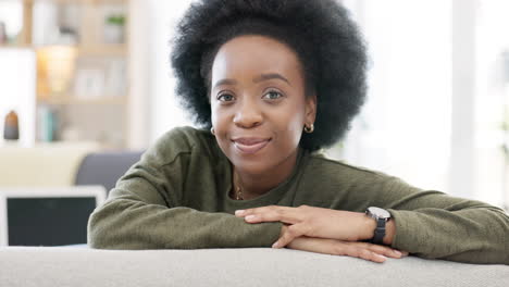 face of a happy afro woman relaxing indoors