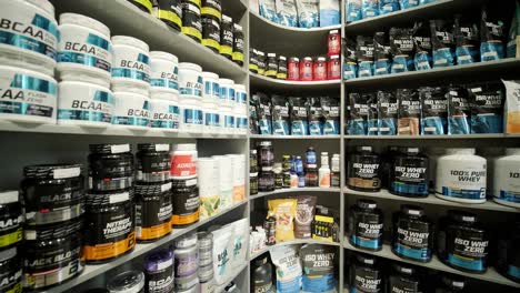 sport nutrition store interior with large choice of nutritional supplements.