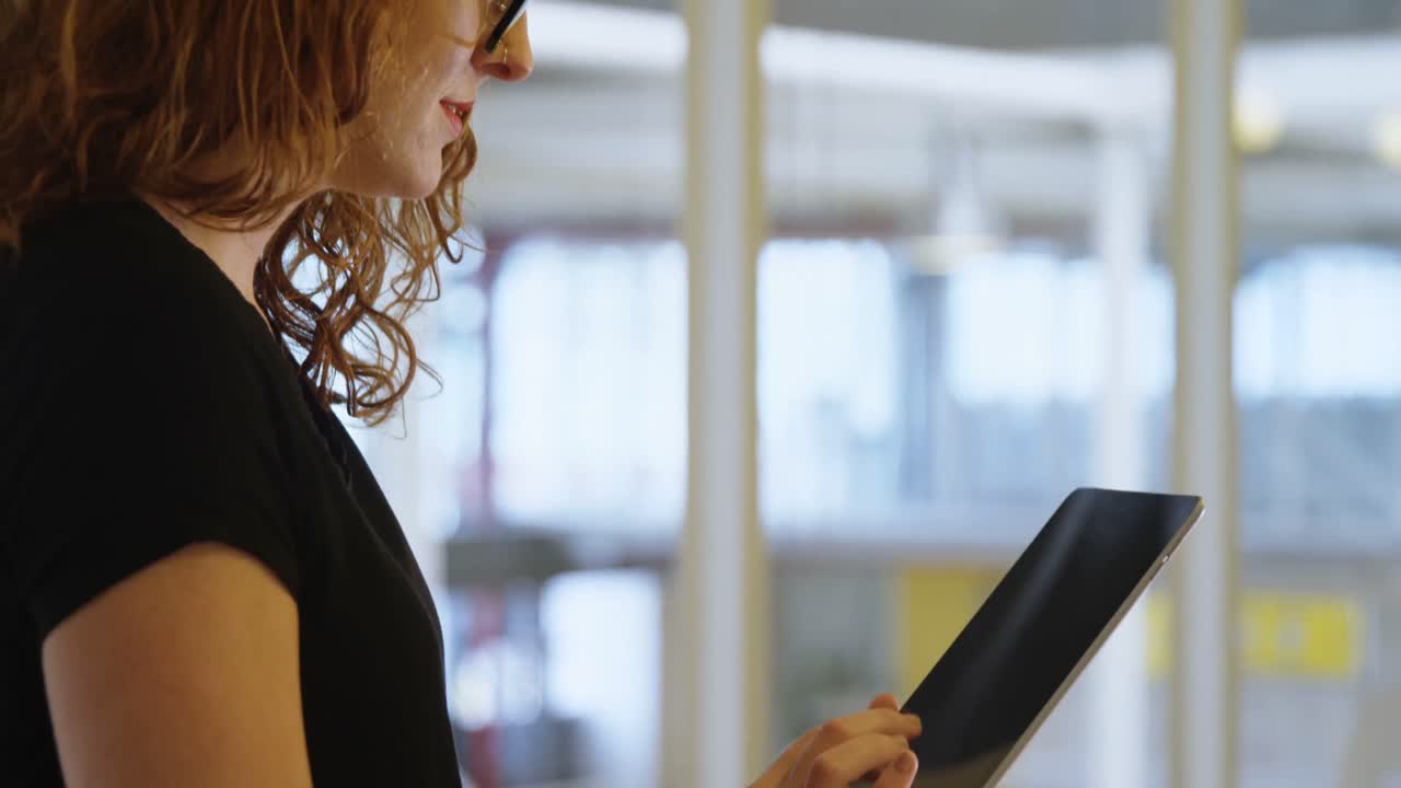 Businesswoman using digital tablet in office 4k