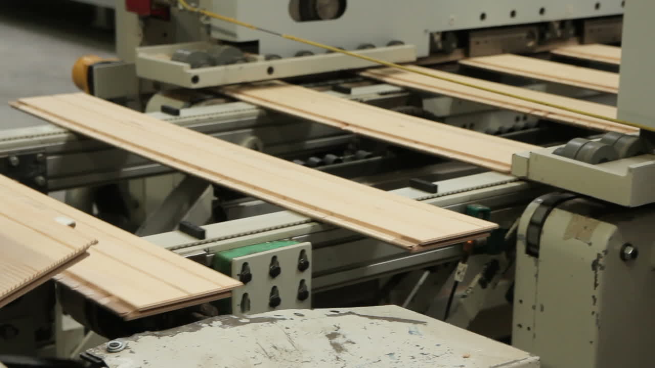 Floorboard Production In The Factory. Floorboard production in the industrial factory. Modern technologies.
