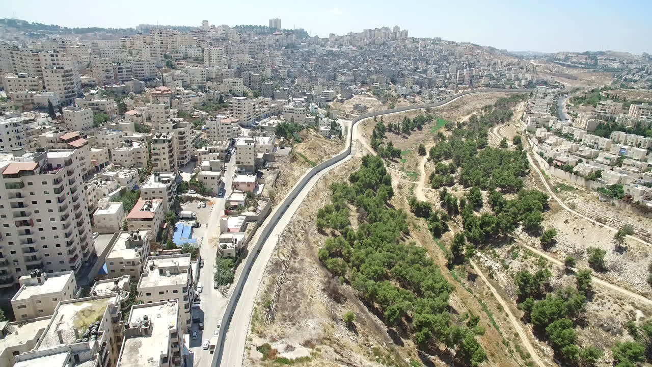 Aerial View of Urban Landscape and Separation Barrier