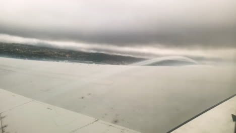 airplane window pov with visible airflow over wing on take-off