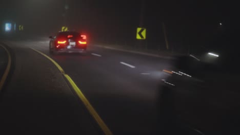 cars driving on motorway during nighttime - wide