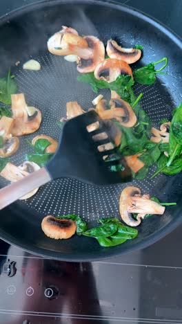 frying mushrooms and spinach