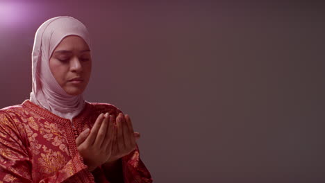 Studio-Head-And-Shoulders-Portrait-Of-Muslim-Woman-Wearing-Hijab-Praying-11