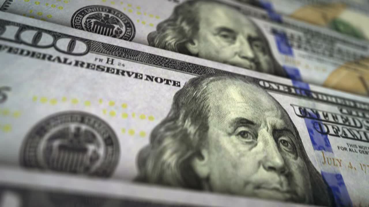 animación del bucle de la superficie del billete de dinero en dólares