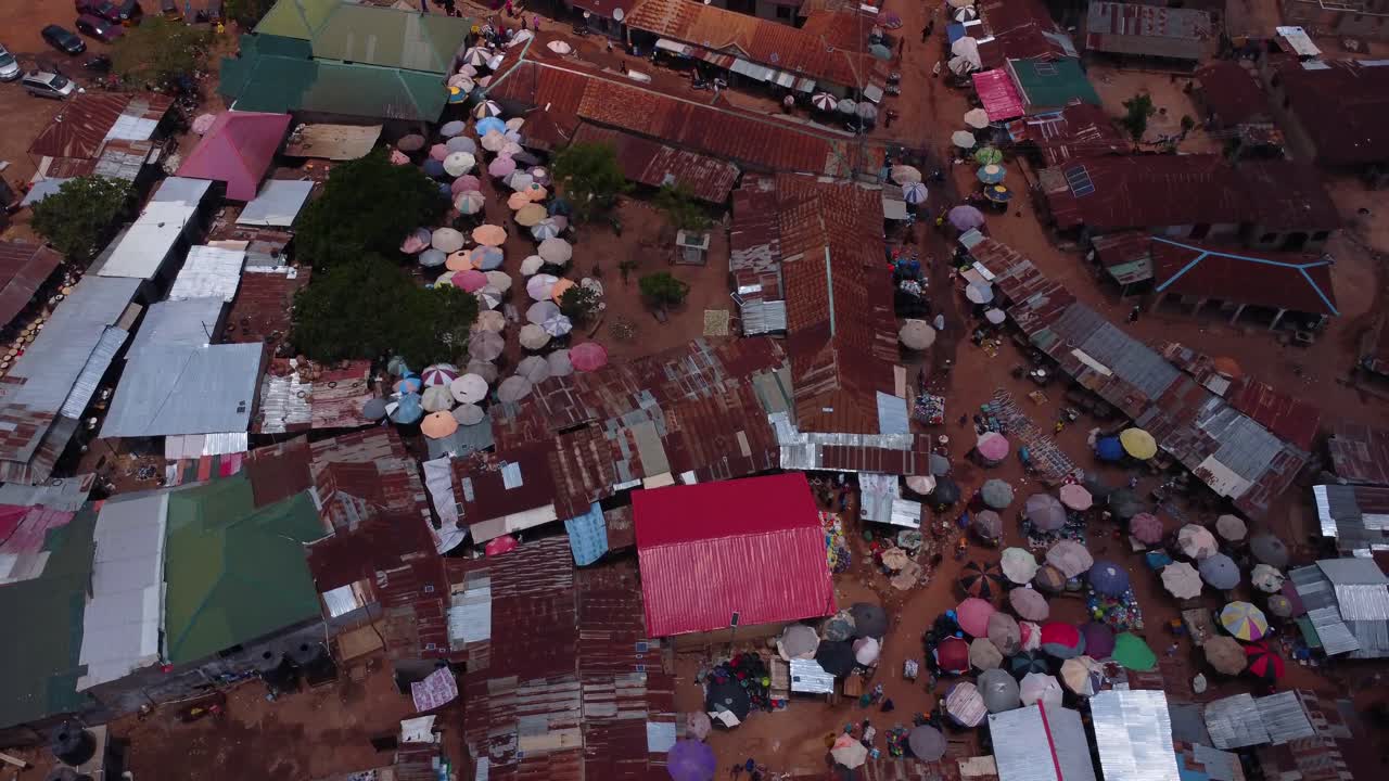 Drone top down view over Karshi market showcasing rooftops and street life Abuja
