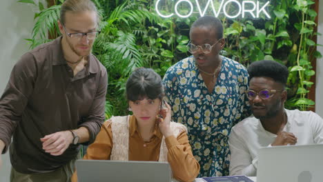 business team cooperating in modern coworking room