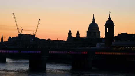 sunset towards st pauls and cannon street bridge, london, united kingdom