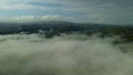 aerial drone above fluffy grey clouds and mist at dawn, 4k