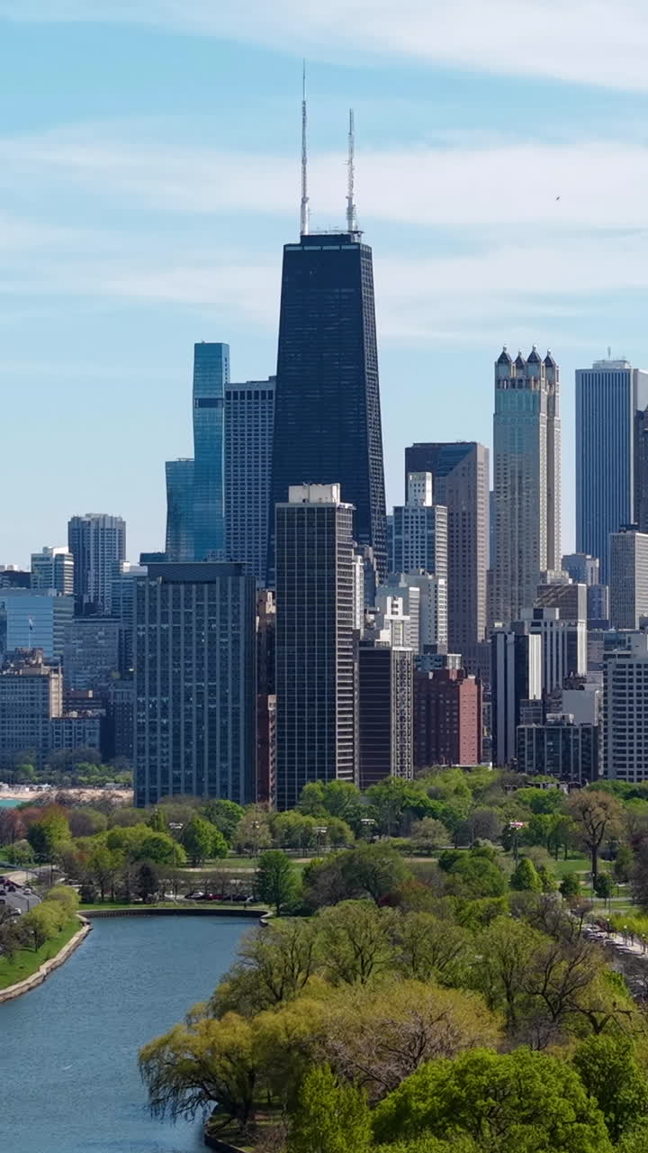 Vertical Drone Shot of Downtown Chicago USA Skyline, Towers and Skyscrapers View From Lincoln Park