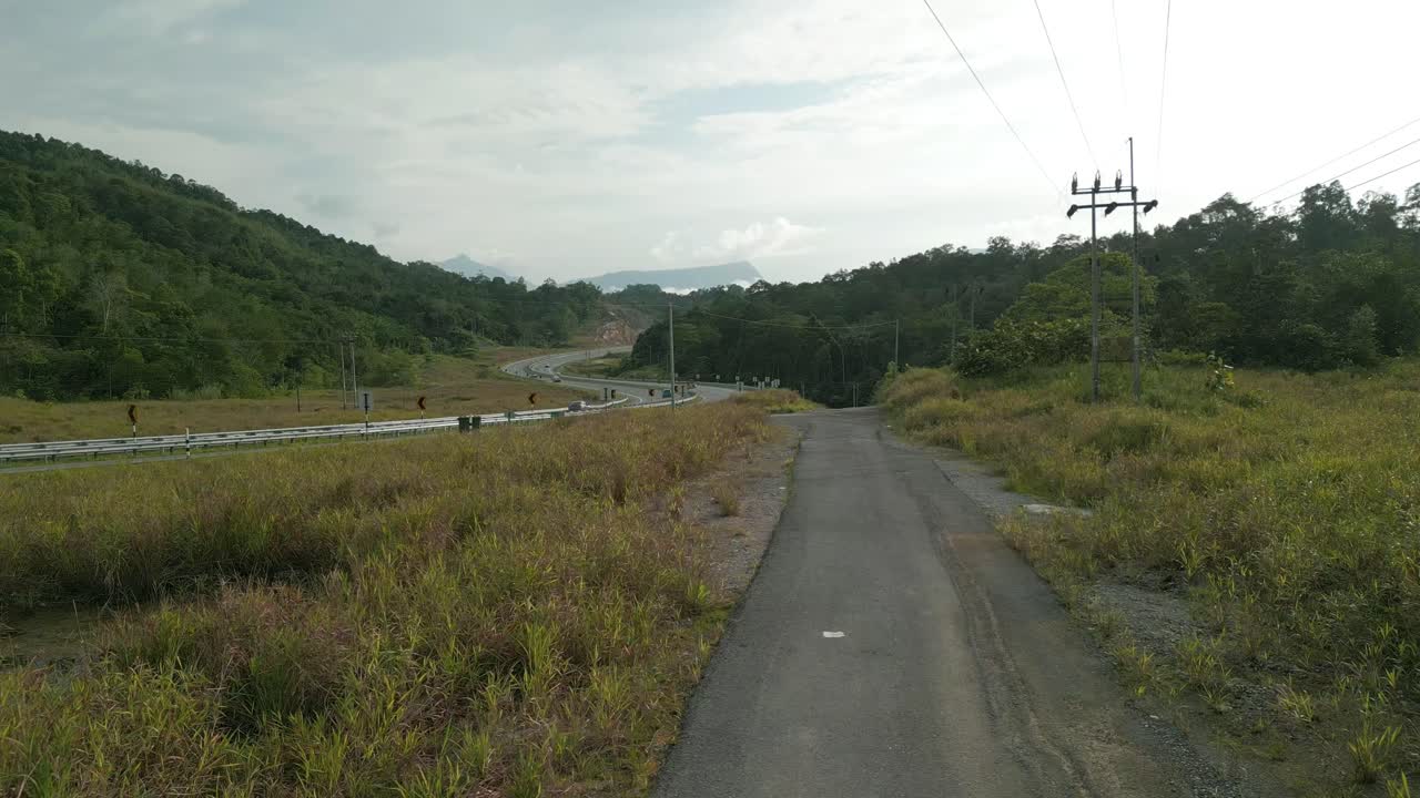 Beautiful Drone View Of Bau To Lundu Pan Borneo Highway During Morning Sunset With Mountain And Valley, Green Forest,Sarawak, Borneo.