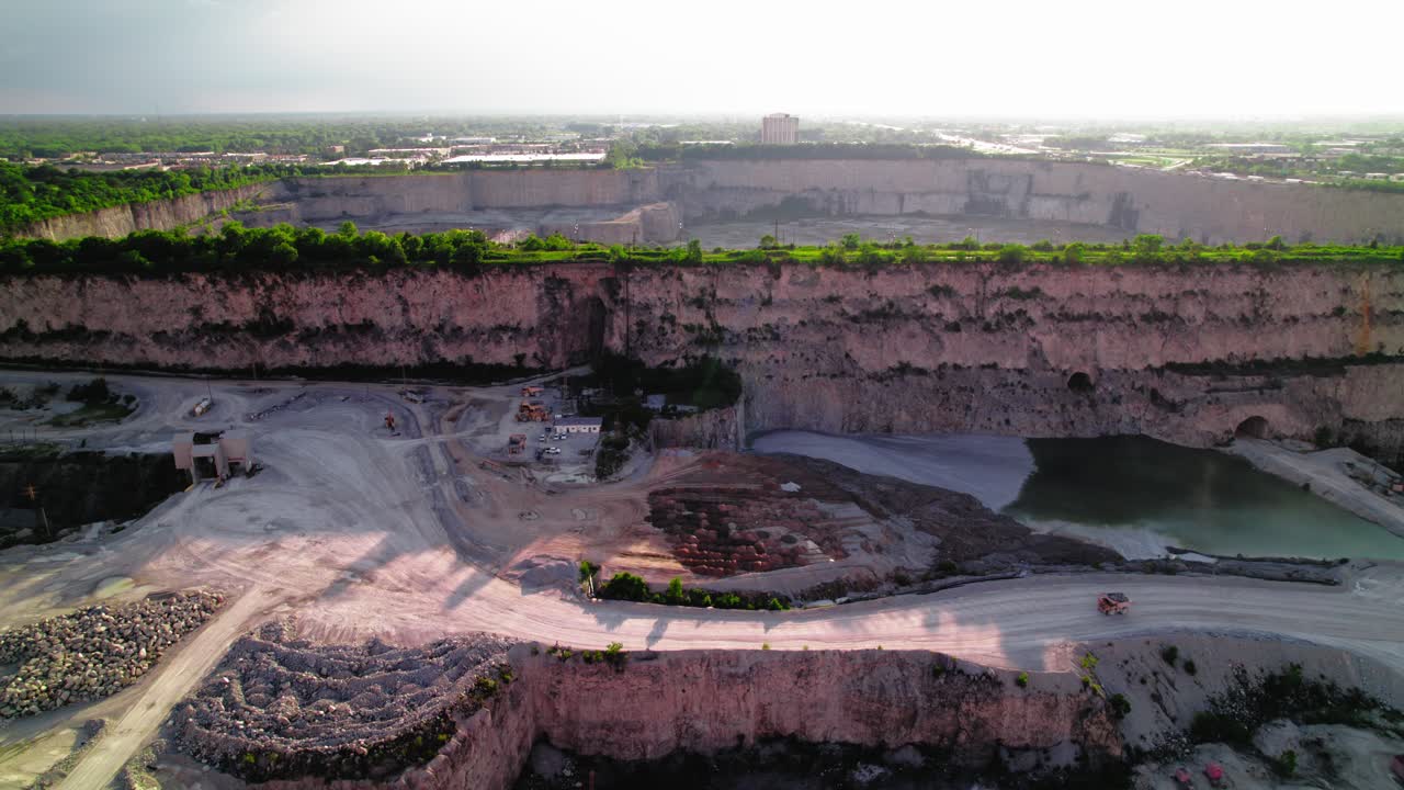 Haul Truck driving Thornton Illinois Quarry: Massive Limestone Excavation Site Reveals Geological Layers and Mining Operations
