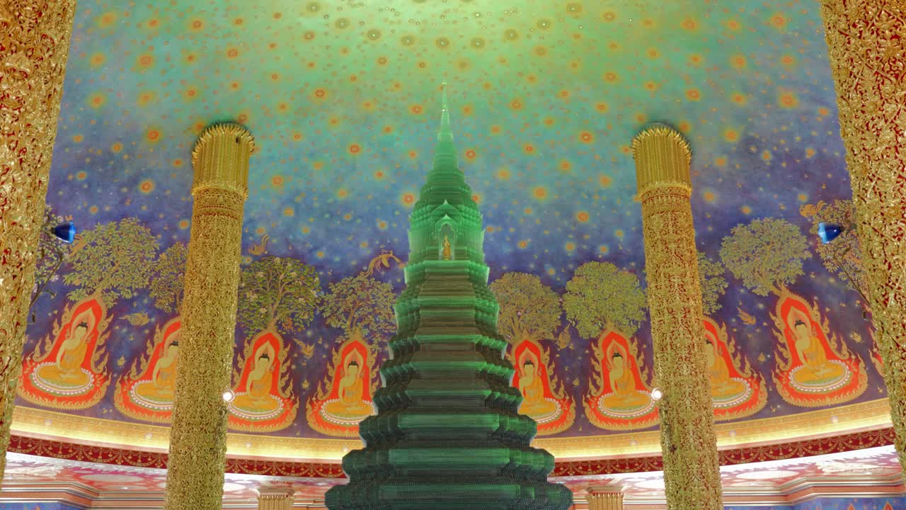 Footage of the green emerald stupa inside Wat Paknam Phasi Charoen Temple in Bangkok, Thailand. The video captures the intricate architecture, vibrant colors