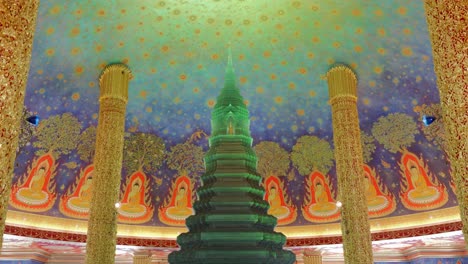 footage of the green emerald stupa inside wat paknam phasi charoen temple in bangkok, thailand. the video captures the intricate architecture, vibrant colors
