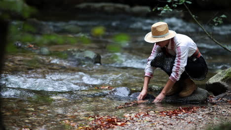 romanian girl plays with sticks in the water 1