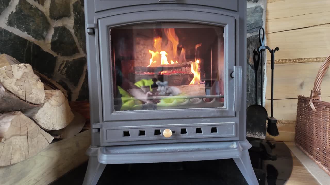 Relaxation in a cozy house with a fire burning in the fireplace - 4K