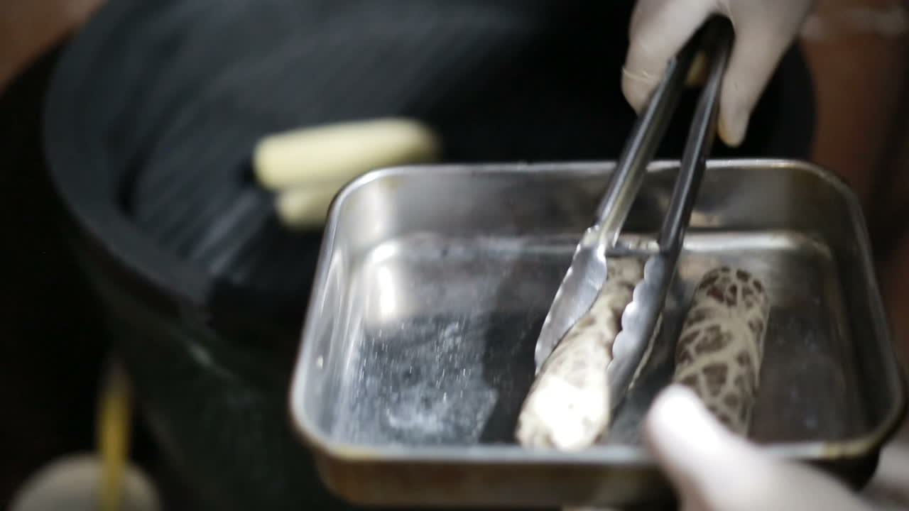 Chef In Restaurant Kitchen Cooking. Chef cook in uniform at the restaurant kitchen