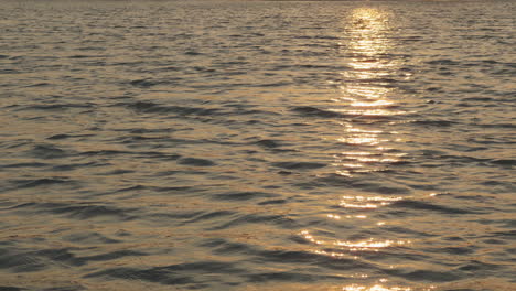 sunset on koh phi phi with sun reflection on the calm sea