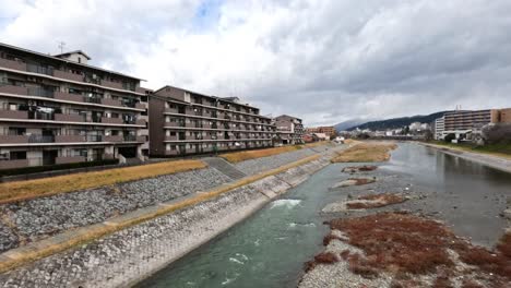 a serene canal flows through kyoto town