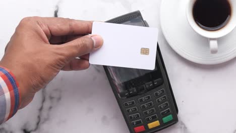 paying with credit card at a cafe