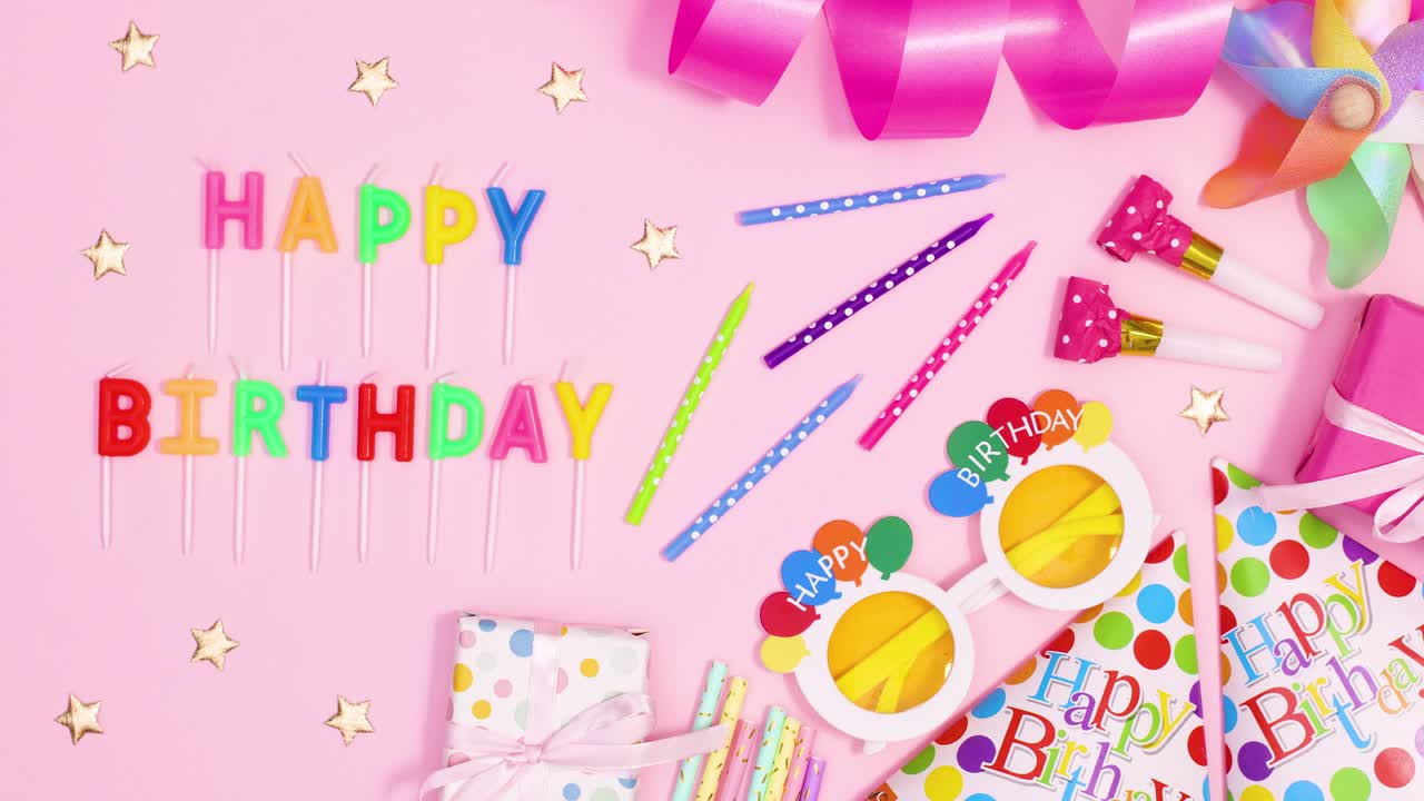 Party decorations and candles appear on pastel pink theme. Stop motion