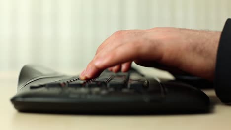 hands typing on the computer keyboard