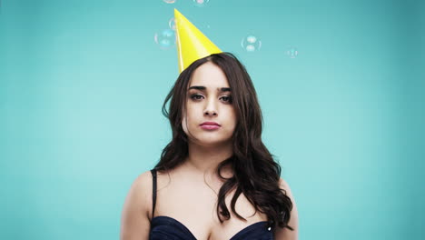 woman wearing a party hat with bubbles