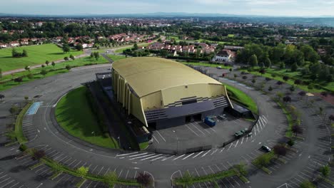 drone shot around le scarabée salle de spectacle, theater in roanne agglomeration on a sunny summer day, loire department, auvergne rhone alpes region in french countryside