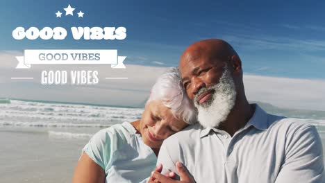 Animation-of-good-vibes-text-over-smiling-senior-african-american-couple-at-beach