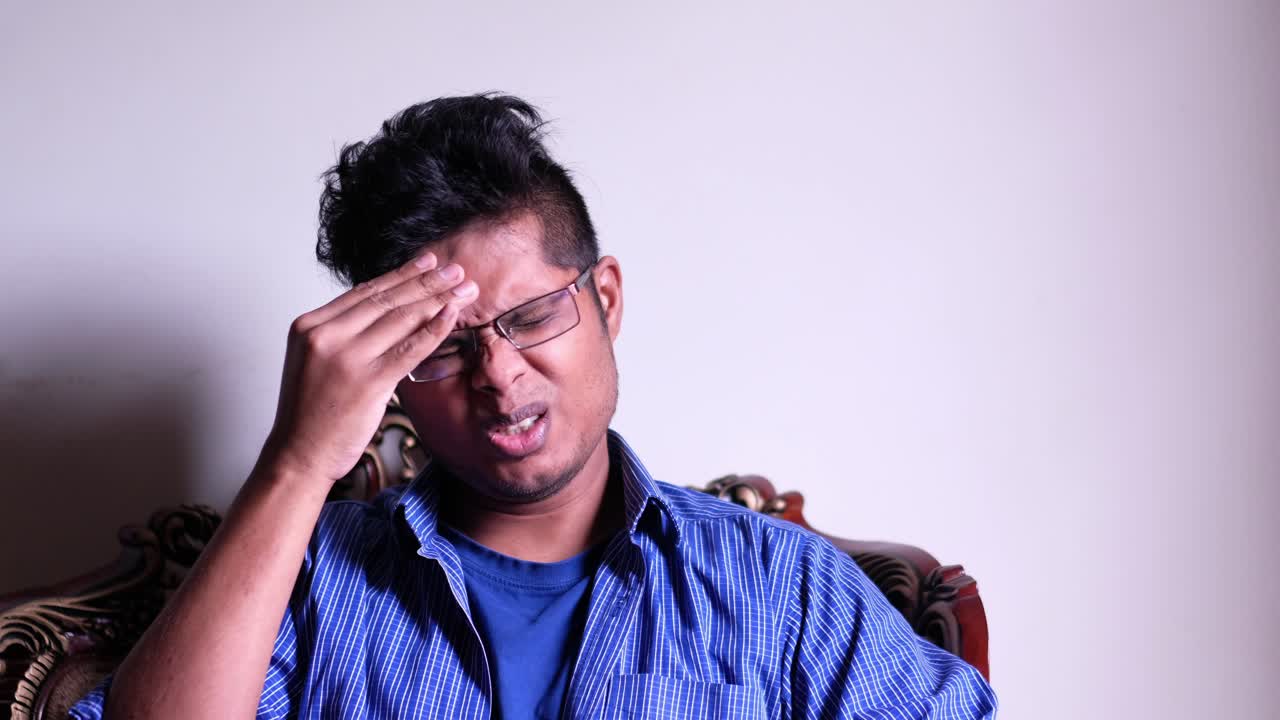 Man Experiencing Headache